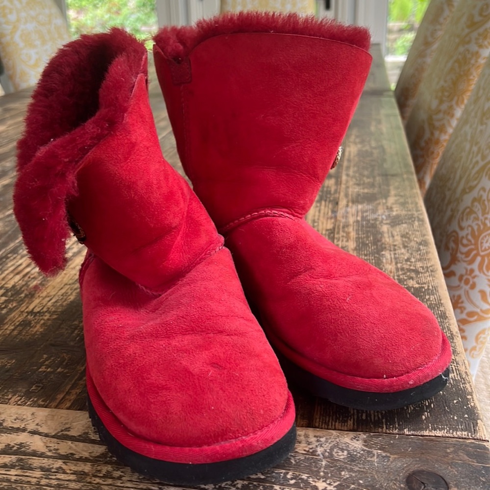 US size 8 red UGGS with black and gold closure. Lightly used.